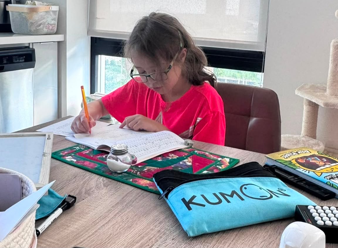 A child completing a short daily math practice set